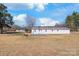 A charming home surrounded by a large yard and wooded areas offers a serene and private setting at 4783 Rainey Ln, Maiden, NC 28650