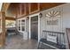 Inviting front porch featuring stylish décor, including a bench, chair, and decorative accents at 4783 Rainey Ln, Maiden, NC 28650