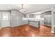 Modern kitchen with gray cabinets, stainless steel appliances, a center island, and hardwood flooring at 4783 Rainey Ln, Maiden, NC 28650