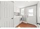 Well-lit laundry room with storage cabinets, washer, and dryer at 4783 Rainey Ln, Maiden, NC 28650