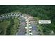 Aerial view of a residential neighborhood nestled among lush green trees and winding roads at 4922 Looking Glass Trl, Denver, NC 28037
