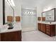 Elegant bathroom boasts a glass enclosed shower, double sinks, and stylish fixtures and tile at 4922 Looking Glass Trl, Denver, NC 28037