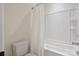 Clean and bright bathroom featuring white tile and fixtures, complete with a bathtub-shower combo at 4922 Looking Glass Trl, Denver, NC 28037