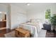 A cozy bedroom with a wooden chest at the end of the bed and a ceiling fan at 4922 Looking Glass Trl, Denver, NC 28037