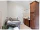 Functional laundry area featuring modern washer and dryer, built-in cabinets, and a utility sink at 4922 Looking Glass Trl, Denver, NC 28037