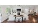 Cozy living room featuring a fireplace, hardwood flooring, and neutral furnishings, with an adjacent dining room at 4922 Looking Glass Trl, Denver, NC 28037