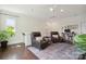 Upstairs loft space featuring hardwood flooring and ample lighting, perfect for a study or additional seating area at 4922 Looking Glass Trl, Denver, NC 28037