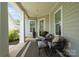Cozy porch with comfortable seating and stylish decor, perfect for relaxing outdoors at 4922 Looking Glass Trl, Denver, NC 28037