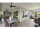 Relaxing screened porch offers outdoor seating, ceiling fans and space for entertaining at 4922 Looking Glass Trl, Denver, NC 28037