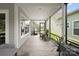 Relaxing screened porch offers outdoor seating, lighting, and great yard views at 4922 Looking Glass Trl, Denver, NC 28037