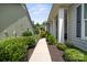 Inviting walkway leading to a charming home with lush landscaping at 4922 Looking Glass Trl, Denver, NC 28037