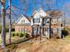 Charming two-story brick home featuring a well-maintained lawn and inviting curb appeal at 501 Aspen Ln, Indian Trail, NC 28079