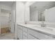 Modern bathroom with double sinks, quartz countertops, and walk-in shower at 557 Mountain View Dr, Monroe, NC 28110