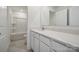 A bathroom featuring sleek white cabinets, quartz countertops, and a bathtub with shower at 557 Mountain View Dr, Monroe, NC 28110