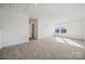 Upstairs bonus room offers extra living space and natural light at 557 Mountain View Dr, Monroe, NC 28110