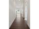 Hallway with wood flooring and white walls and doors at 557 Mountain View Dr, Monroe, NC 28110