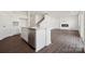 A modern kitchen with a center island, stainless steel appliances, and an open floor plan at 557 Mountain View Dr, Monroe, NC 28110