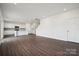 Open-concept living area features hardwood floors, modern kitchen, and abundant natural light at 557 Mountain View Dr, Monroe, NC 28110