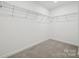 Walk-in closet with ample shelving for storage at 557 Mountain View Dr, Monroe, NC 28110