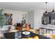 Open-concept living space with a modern kitchen, dining area, and comfortable seating at 7004 Matz Way, Charlotte, NC 28269