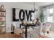Modern dining room featuring stylish chandelier, art and seating with elegant rug at 7008 Matz Way, Charlotte, NC 28269