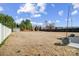 Expansive backyard with lush lawn, privacy fence, and mature trees provides ample space at 7348 Adirondack Dr, Denver, NC 28037