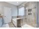 Luxurious bathroom featuring a glass shower, soaking tub and modern fixtures at 7348 Adirondack Dr, Denver, NC 28037