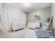 A charming Bedroom featuring a crib, dresser, chair and decorative accents at 7348 Adirondack Dr, Denver, NC 28037