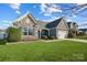 Beautifully landscaped front yard with stone and siding accents at 7348 Adirondack Dr, Denver, NC 28037