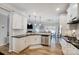 Open-concept kitchen with stainless steel appliances and a view into the breakfast room at 7348 Adirondack Dr, Denver, NC 28037