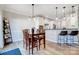 Bright, updated kitchen with pendant lighting, breakfast bar and wood dining set at 7348 Adirondack Dr, Denver, NC 28037