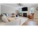 Spacious living room with a comfortable sectional sofa, fireplace, and natural light at 7348 Adirondack Dr, Denver, NC 28037