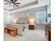 Cozy main bedroom with tray ceiling, ceiling fan, and neutral decor at 7348 Adirondack Dr, Denver, NC 28037