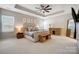 Spacious Primary bedroom suite with tray ceiling, ceiling fan, and neutral decor at 7348 Adirondack Dr, Denver, NC 28037