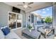Covered patio with comfortable seating, ceiling fan, and outdoor television for relaxation at 7348 Adirondack Dr, Denver, NC 28037