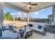 Covered outdoor patio featuring comfortable seating, string lights, and a ceiling fan at 7348 Adirondack Dr, Denver, NC 28037