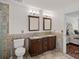 Bathroom with a dual sink vanity, granite countertops, and beautiful tile backsplash at 7824 Hickory Stick Pl, Charlotte, NC 28277