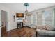 Cozy room featuring hardwood floors, a decorative ceiling fixture, and plenty of natural light from the bright windows at 7824 Hickory Stick Pl, Charlotte, NC 28277