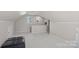 Versatile bonus room with sloped ceilings, a comfortable sitting area, and neutral decor at 7824 Hickory Stick Pl, Charlotte, NC 28277