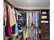 Spacious walk-in closet with built-in shelving and ample storage for clothes and accessories at 7824 Hickory Stick Pl, Charlotte, NC 28277