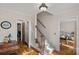 Inviting foyer with hardwood floors, stairs to the second level, and seamless access to living areas at 7824 Hickory Stick Pl, Charlotte, NC 28277