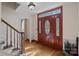 Elegant foyer featuring a hardwood floor and a beautifully crafted front door with glass accents at 7824 Hickory Stick Pl, Charlotte, NC 28277