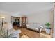 Inviting living room with hardwood floors, cozy seating, and seamless access to other living areas at 7824 Hickory Stick Pl, Charlotte, NC 28277