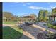 Expansive backyard with a brick patio, dining set, lounge chairs, and a well-maintained lawn at 8724 Highgrove St, Charlotte, NC 28277