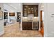 Stylish bar area with custom cabinetry, granite countertops, and wine cooler, perfect for entertaining at 8724 Highgrove St, Charlotte, NC 28277