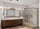 Bathroom with double vanity, granite countertops, and tiled walk-in shower at 8724 Highgrove St, Charlotte, NC 28277