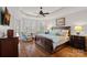 Luxurious bedroom with tray ceiling, bay window, and elegant furnishings at 8724 Highgrove St, Charlotte, NC 28277
