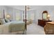 A four poster bed offers luxury and comfort to this bedroom with ample lighting at 8724 Highgrove St, Charlotte, NC 28277