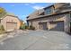 Spacious three-car attached garage and detached garage, offering ample parking and storage space at 8724 Highgrove St, Charlotte, NC 28277