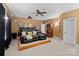 A home theater showcasing tiered seating, a projector, and a vintage display case at 8724 Highgrove St, Charlotte, NC 28277